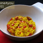 Arroz con pimientos rojos y jamón serrano cocinado al horno