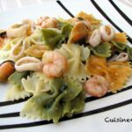 Plato de pajaritas con gambas, calamares y mejillones al ajillo